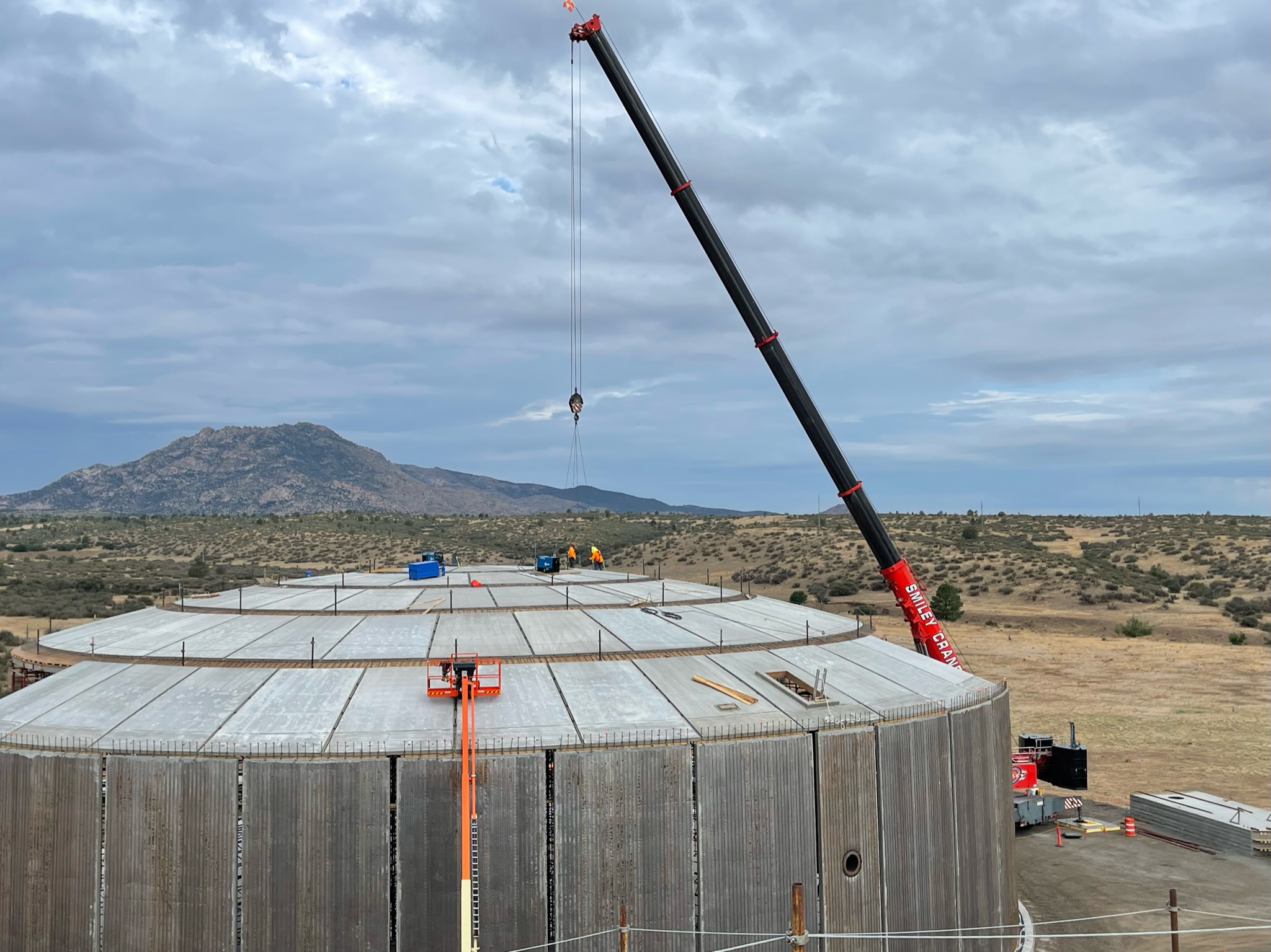 Certified welder placing inspected welds on seismic rebar for a City of Prescott water reservoir